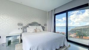 Säng eller sängar i ett rum på Villa Bonsai