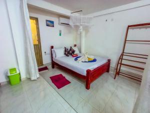 Letto o letti in una camera di Sigiri Tarushan Home Stay