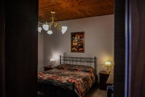 Säng eller sängar i ett rum på Etna Dimora dei Saponari