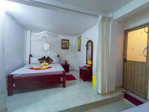 Letto o letti in una camera di Sigiri Tarushan Home Stay