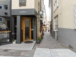 an empty street in a city with buildings at Comfortable Apartment in Zell am See near Forest in Zell am See