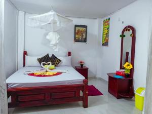 Letto o letti in una camera di Sigiri Tarushan Home Stay