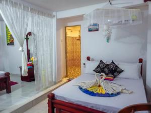 Letto o letti in una camera di Sigiri Tarushan Home Stay