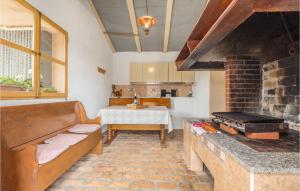 a living room with a couch and a brick oven at Stunning Home In Labin With Outdoor Swimming Pool in Labin