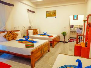 Letto o letti in una camera di Sigiri Tarushan Home Stay