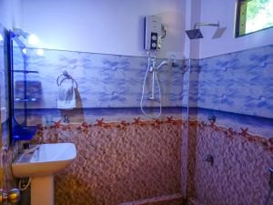 Koupelna v ubytování Sigiri Tarushan Home Stay