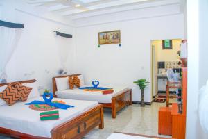 Letto o letti in una camera di Sigiri Tarushan Home Stay