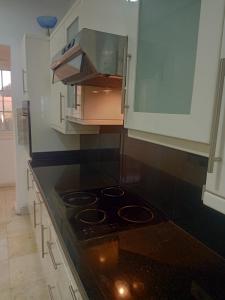 a kitchen with a stove and a counter top at new marina heart of Hurghada in Hurghada