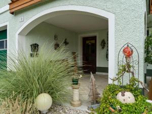 an entrance to a house with plants in front of it at Cosy Apartment in Oed hling with Garden in Mauer bei Amstetten