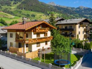 a house with a view of a mountain at Spacious Apartment in Grossarl with Garden in Grossarl