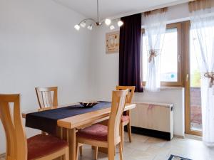 a dining room with a table and chairs at Beautiful Holiday Home in Ulrichsberg with Balcony in Ulrichsberg