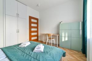Posteľ alebo postele v izbe v ubytovaní LTC - Apartments Piłsudskiego przy Bulwarze