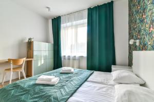 Posteľ alebo postele v izbe v ubytovaní LTC - Apartments Piłsudskiego przy Bulwarze