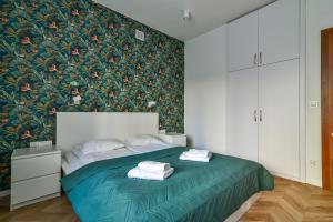 Posteľ alebo postele v izbe v ubytovaní LTC - Apartments Piłsudskiego przy Bulwarze