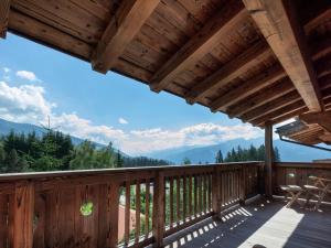 a deck with a view of the mountains at Apartment with a lift in Mittersill Salzburg in Hollersbach im Pinzgau