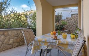a table with fruit on it on a patio at One-Bedroom Apartment In Ploce in Blace +16 photos