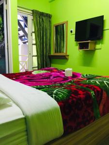 Postel nebo postele na pokoji v ubytování Rose Haven Hotel
