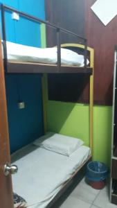 Postel nebo postele na pokoji v ubytování Rose Haven Hotel