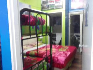 Postel nebo postele na pokoji v ubytování Rose Haven Hotel