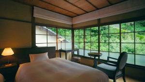 Katil atau katil-katil dalam bilik di NIPPONIA HOTEL Ozu Castle Town