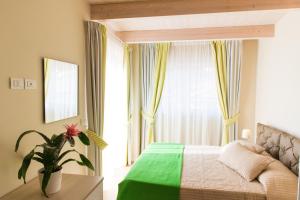 Postel nebo postele na pokoji v ubytování Resort Cupra