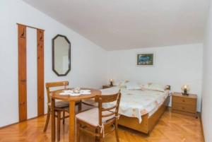 Posteľ alebo postele v izbe v ubytovaní Apartment Tomisha