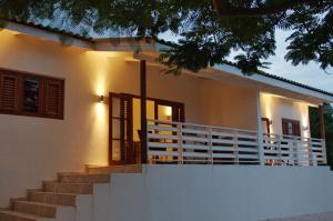 a house with stairs leading to the front door at Bantopa Apartments in Willemstad