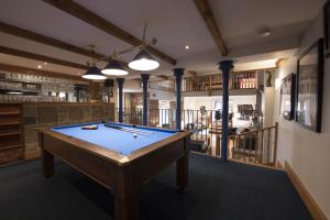 a pool table in the middle of a room at Hill Top Farm 8 in Bainbridge