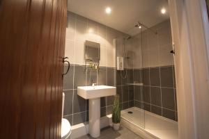 a bathroom with a sink and a shower at Hill Top Farm 8 in Bainbridge +38 photos