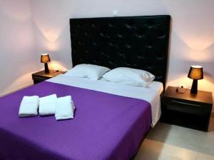 Posteľ alebo postele v izbe v ubytovaní Spilios Apartment