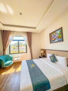 Voodi või voodid majutusasutuse Crown Dalat Hotel toas