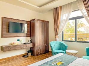Voodi või voodid majutusasutuse Crown Dalat Hotel toas