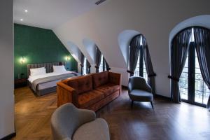 Postel nebo postele na pokoji v ubytování Molokan Inn Hotel + 37 fotografií