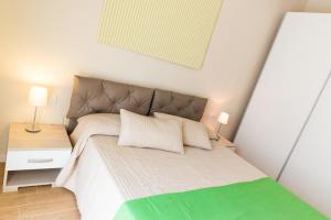Postel nebo postele na pokoji v ubytování Resort Cupra