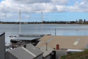 a boat docked at a marina on the water at My Port Lincoln Place in Port Lincoln