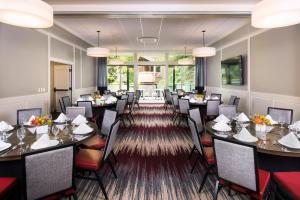 a large dining room with tables and chairs at The Gant in Aspen