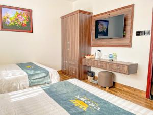 Voodi või voodid majutusasutuse Crown Dalat Hotel toas