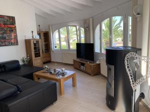 Telewizja i/lub zestaw kina domowego w obiekcie Villa Emilia 8 PAX