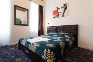 Voodi või voodid majutusasutuse Royal Apartment on Pushkinskaya toas