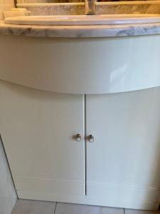 a counter top on top of a white cabinet at Charmant studio avec piscine . in Afa