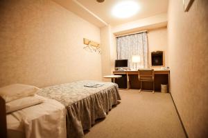 Postel nebo postele na pokoji v ubytování Narita U-City Hotel