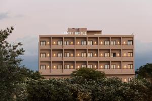 a hotel building with a sign on top of it at Kriti Hotel in Chania Town