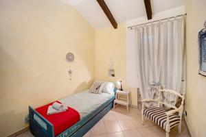 A bed or beds in a room at La casa nel Caruggio