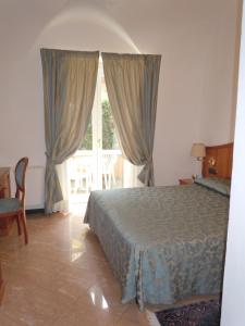 Кровать или кровати в номере Hotel Due Mari