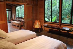 Voodi või voodid majutusasutuse Hamadryade Lodge toas
