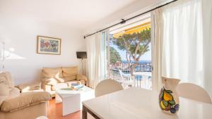 a living room with a view of the ocean at Apartment Bone 2 - Llafranc in Llafranc