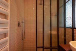 a bathroom with a shower and a sink at Skyline 1/7 B&B in Bologna