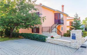a house with a staircase in front of it at Apartment Labin Presika Ii in Labin