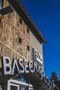 a sign on the side of a building at Hotel Base Camp Lodge - Les 2 Alpes in Les Deux Alpes