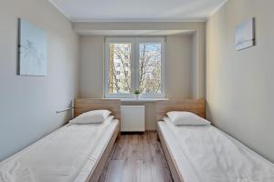 Posteľ alebo postele v izbe v ubytovaní Comfort Apartments Gdynia Centrum
